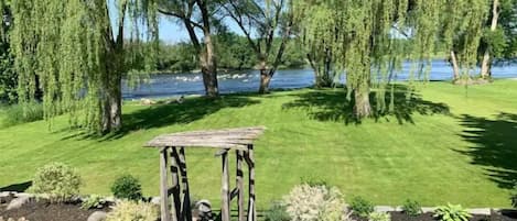 View of the Trent River and lawn from the deck. Beautiful sunrises every morning