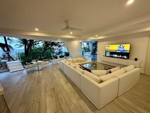 The upper family room is ideal for entertaining, playing games and movies.