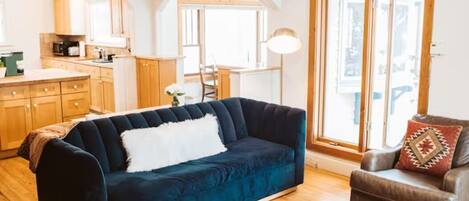 Upstairs livingroom. Open, bright and airy layout with a sofa bed.