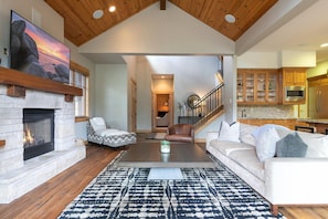 Modern Open Living Area featuring a Smart TV & Gas Fireplace