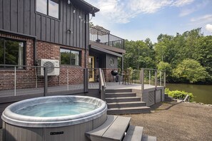 View of hot tub, upper and lower decks, and the Esopus