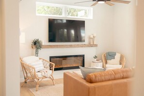 Read by the Cozy Fireplace or weather a storm with your favorite show on the Smart TV