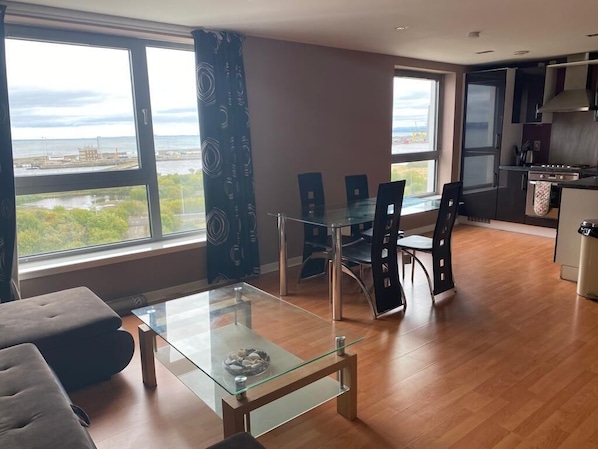 Living room with dining, views over the Forth bay