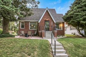 Front of home with inviting front patio. Home is much larger than it looks!