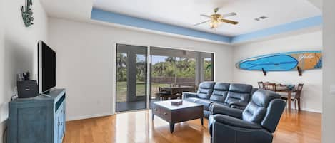 living room with view of large backyard