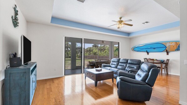 living room with view of large backyard