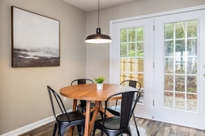 Dining room set for four! This leads you out to the rear private hot tub patio!