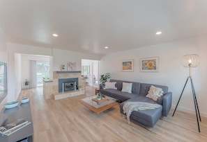 Living Room has a Candlelit Fireplace and HDTV