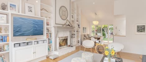 Living Room with Wood Fireplace and Smart TV