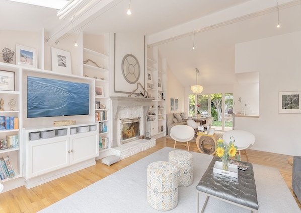 Living Room with Wood Fireplace and Smart TV