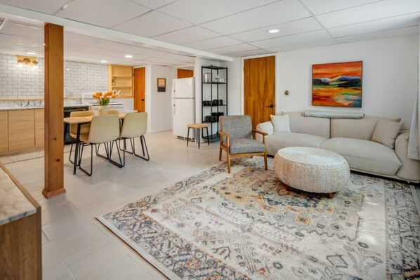 Living room has so much to offer including table for 5 and comfortable seating to watch TV