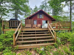 front view with expansive deck overlooking the lake