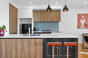 Enjoy the culinary ease of the fully equipped kitchen with quality appliances