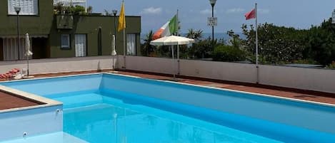 Shared swimming pool open from June to September, supervised by a lifeguard.