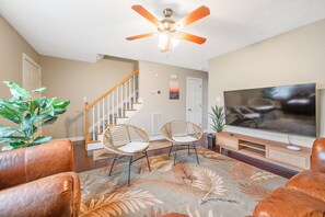 Living Room Retreat: Relax in style with plush seating, vibrant decor, and bright, inviting light!