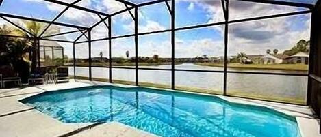How is this for a stunning pool with lake view!