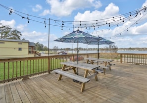 Dining space with shade umbrellas and ambient lighting