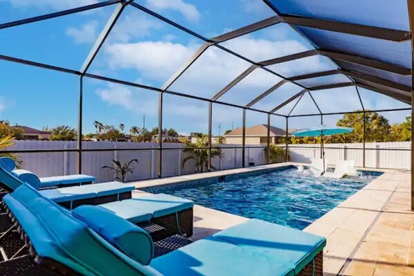 Soak up the sun underneath the poolside lanai!