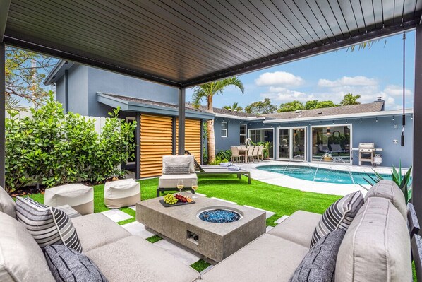 Outdoor Area features heating swimming pool and gas fire pit + shade structure