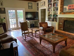 Den with 65" flat screen tv