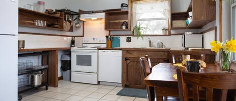 Newly Remodeled Kitchen with full size fridge, dishwasher, and basic cookware. Plenty of storage for coolers and food.