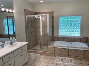 Spacious master bathroom with separate shower and jetted tub