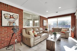 Comfy and fun sunroom overlooking the backyard