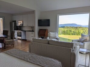 meadow and mountain view from cottage interior