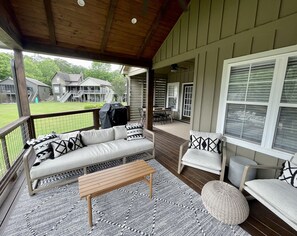 Covered porch and outdoor dining area.