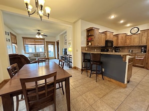 Whether you are cooking in the kitchen, eating at the dining table, or lounging in the living room, the open layout means you can always be a part of the fun in this condo.