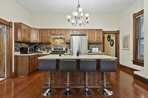 Four bar seats for dining seating at the kitchen island. 