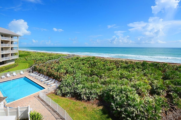 Pelican 1304 Balcony View Overlooking the Pool and Oceanfront