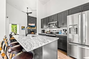 Brand new appliances, premium countertops, and elegant design throughout the interior.