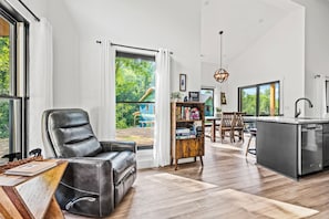 High ceilings, large windows, and lots of natural light make the cabin feel spacious and airy.