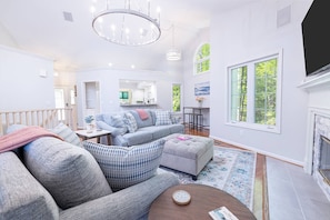 Beautiful, spacious living area with large screen tv and gas fireplace.