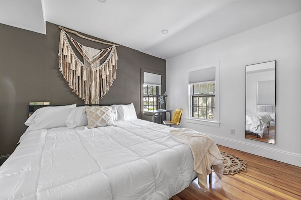 This bedroom features another King Size bed and convenient remote workspace