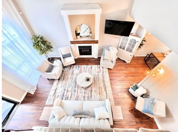 Airy living room with tall ceilings and lots of natural light.