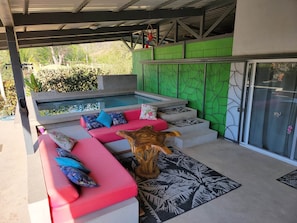 Outdoor living room and pool.