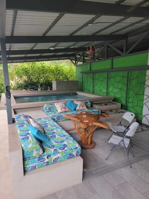 Outdoor living area with pool.