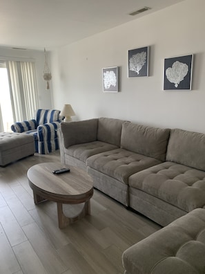 Family room off of the kitchen with bathroom and balcony