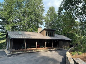 Front of the house with porch, rocking chairs, and a swing