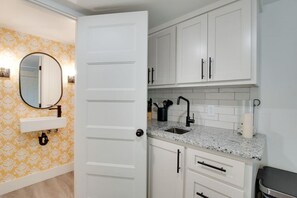 Step into the chic bathroom inside our tiny cottage. Thoughtfully designed with modern touches, sleek fixtures, and amenities for a relaxing experience surrounded by nature