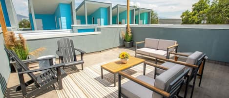 Escape to your personal oasis on the balcony lounge. With comfortable seating and a breathtaking view, it offers a serene and stylish space to unwind, soak up the sun, and enjoy the outdoors in ultimate relaxation.