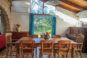 The hand-made timber dining table seats 8. Other tables let kids eat seperately.