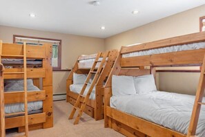 The home features five bedrooms, one of which is a bunk room with 3 sets of bunk beds providing plenty of space for your whole group to get a good night’s rest.