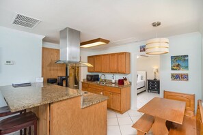 Gather in the charming eat-in kitchen, where meals become memories and conversations flow freely.