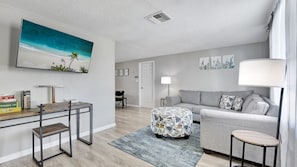 Our inviting living room, where comfort and style seamlessly blend.