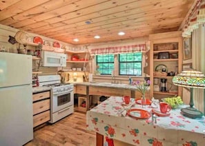 Spacious kitchen with everything you need to cook and serve a meal.