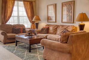 Living Room - Living room with TV. You can watch live tv or use to stream your favorite content using your personal account.