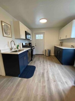 The large kitchen offers plenty of counter space and cabinets!